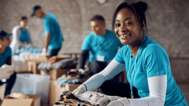 Happy black female volunteer with donation box
